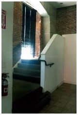 Before: stairs to second floor before rehabilitation